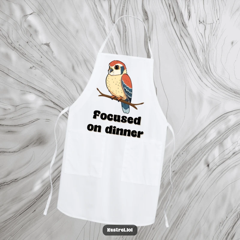 Funny kestrel apron with a determined bird perched and looking intently, adding humor to kitchen tasks.