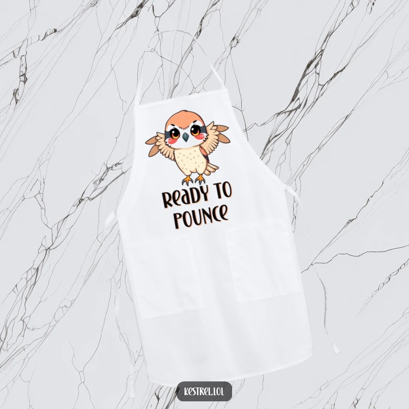 Funny apron showcasing a kestrel character with a determined gaze, preparing for a swift descent, adding humor and focus to cooking.