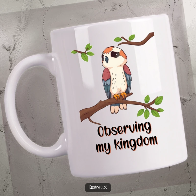 Funny Kestrel Perched Mug showing a kestrel sitting proudly on a high branch, conveying a sense of noble humor.
