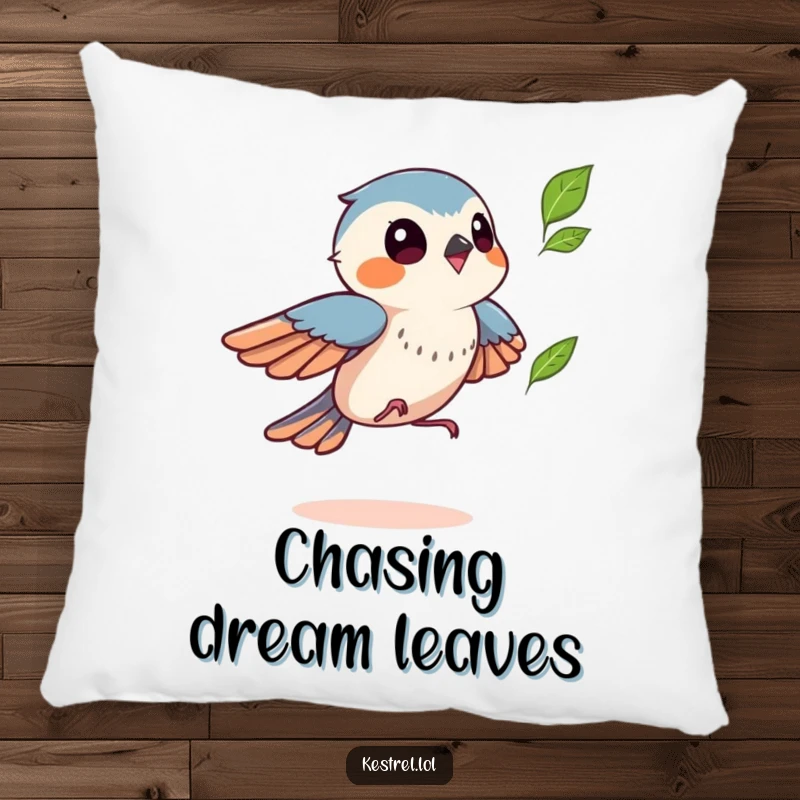 Funny kestrel pillow featuring a bird playfully chasing a leaf, adding a humorous touch of autumn fun to decor, great gift.