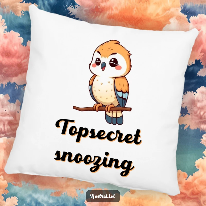 Funny winking kestrel pillow, the bird playfully scouting from a high perch with a wink, a soft and humorous decoration.