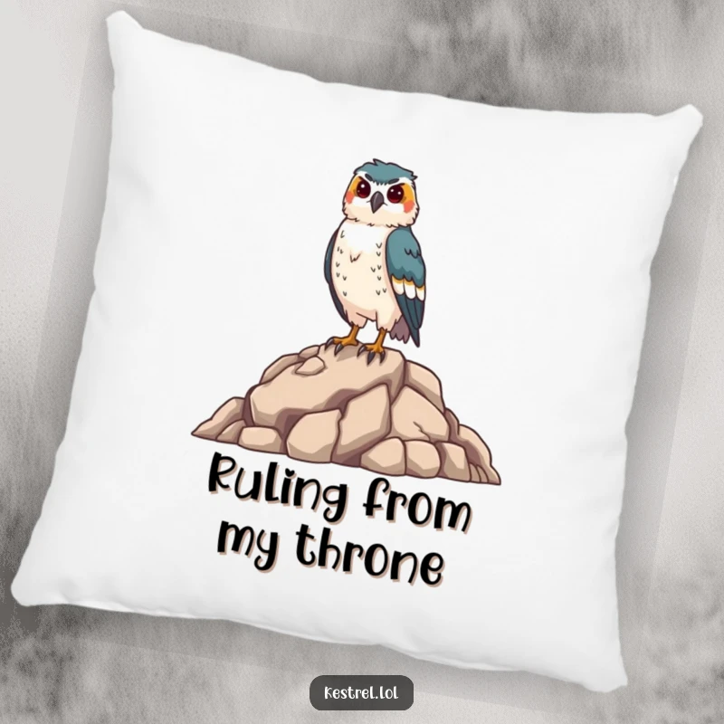 Funny kestrel pillow featuring a proud falcon on a rocky perch, offering comfort and a humorous touch to home decor, a delightful bird gift.