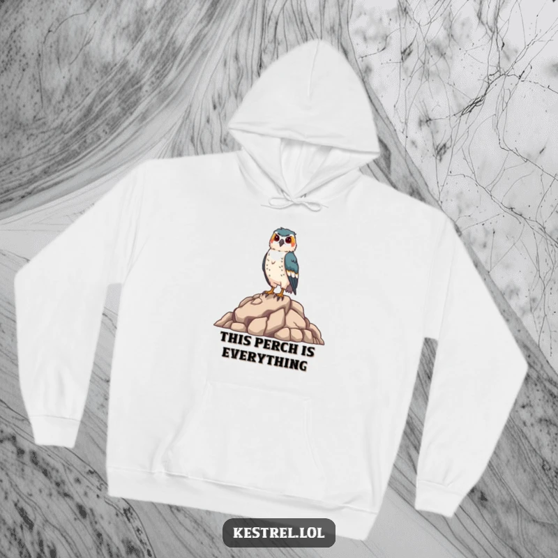 Funny kestrel hoodie featuring a proud falcon standing tall on a rocky outcrop, offering warmth and humor, a perfect funny gift for bird enthusiasts.