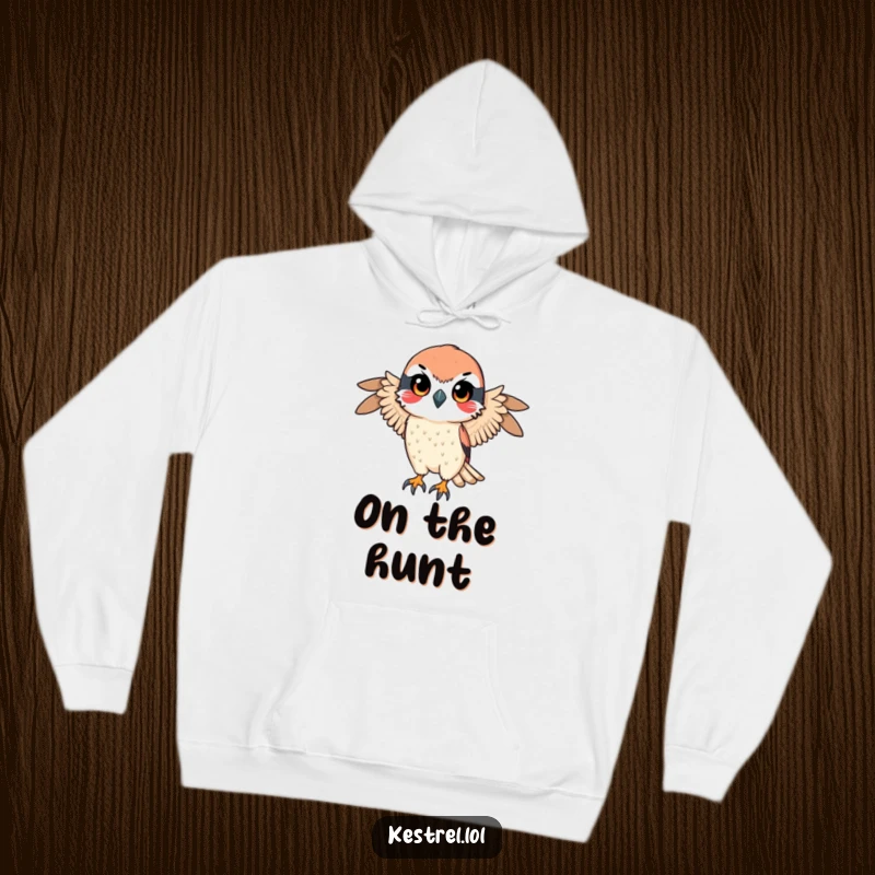 Funny hoodie featuring a kestrel character with a determined gaze, poised for a swift descent, offering comfort with a powerful, focused vibe.