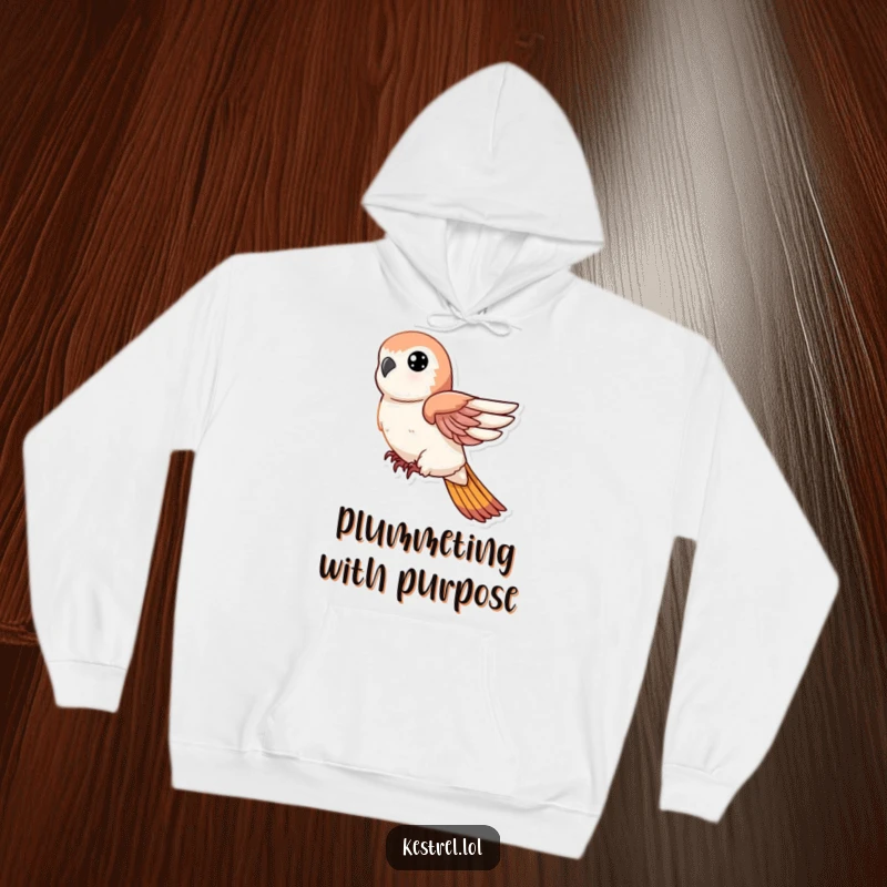 Funny hoodie depicting a kestrel character in a swift, decisive descent with tucked wings, designed for cozy excitement.