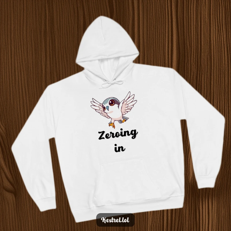 Funny kestrel hoodie with a determined kestrel character diving sharply downwards, offering warmth and a sense of unwavering focus.