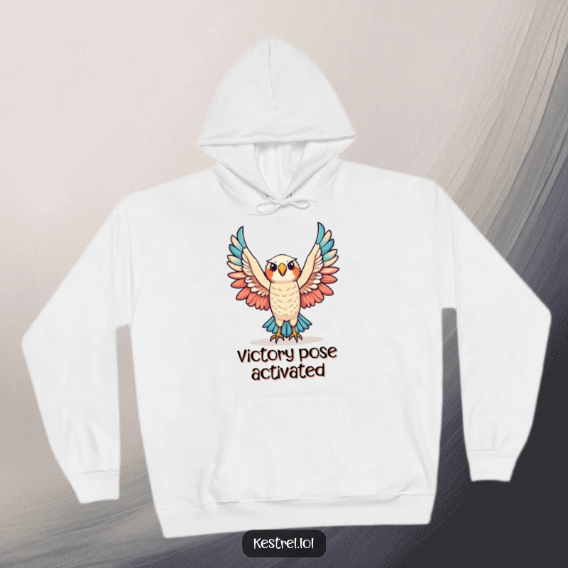 Funny triumphant kestrel hoodie featuring a kestrel character raising its wings in victory, offering warmth and celebration.
