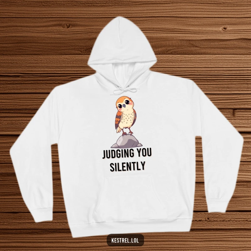 Funny curious kestrel hoodie, featuring a bird with a tilted head, offering comfort and a humorous touch.