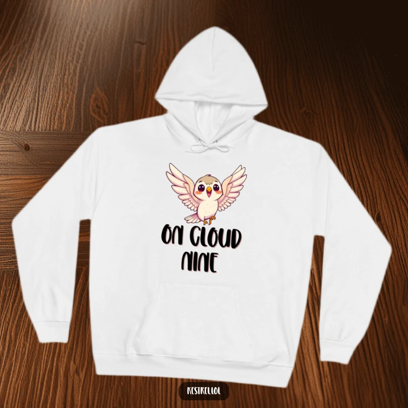 Funny smiling kestrel hoodie, showing the bird eagerly soaring with outstretched wings, a symbol of joyful adventure.