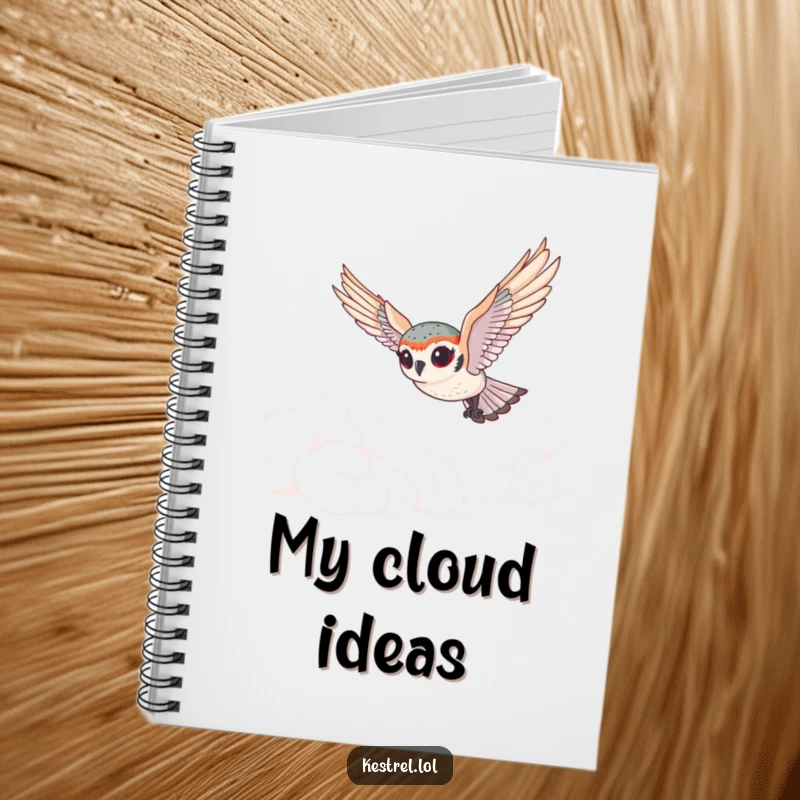 Funny tiny kestrel notebook featuring a cute bird with exaggerated eyes gracefully diving through clouds, perfect for jotting down ideas with playful wonder.