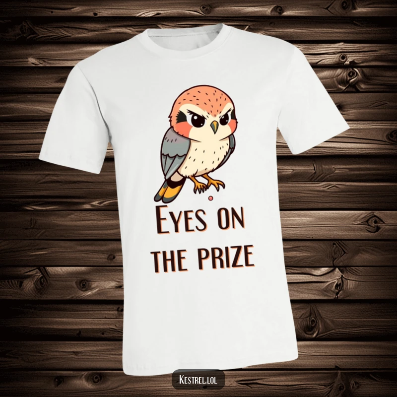Funny Kestrel T-Shirt: A determined kestrel intently eyes a tiny movement below, its expression conveying serious, humorous concentration.