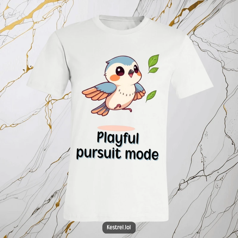 Funny kestrel t-shirt featuring a bird playfully chasing a fluttering leaf, symbolizing autumn fun and lightheartedness, a humorous gift.