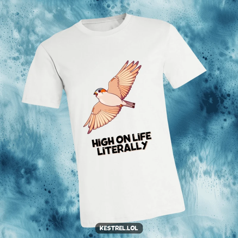 Funny kestrel soaring t-shirt, depicting an energetic bird in a wide arc against a blue sky; great for free spirits.