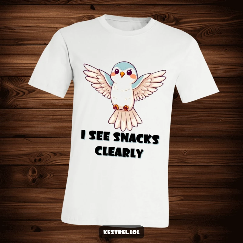 Funny kestrel hovering t-shirt, displaying a joyful bird with wings spread wide, looking down with a smile, great for bird lovers.