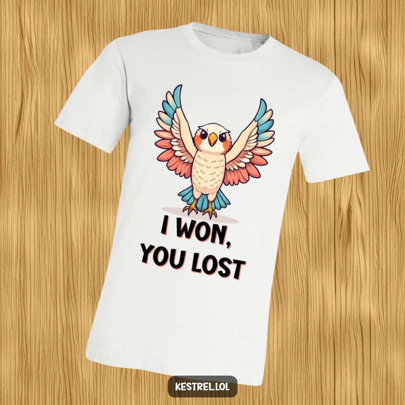 Funny triumphant kestrel t-shirt showing a kestrel character raising its wings in an act of glorious victory.