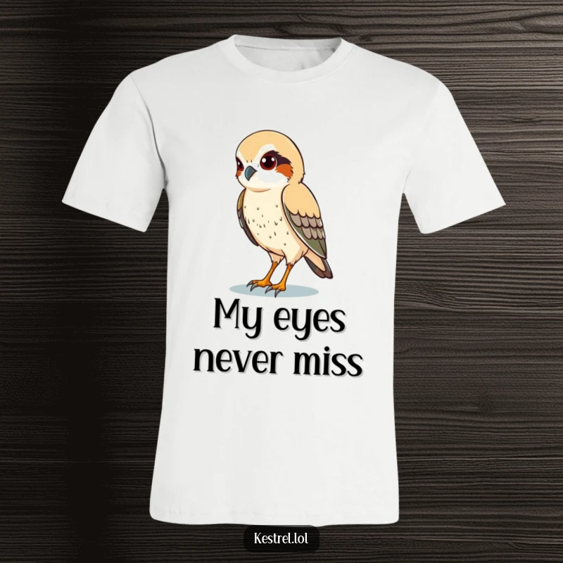 Funny t-shirt featuring a kestrel character with piercing eyes, meticulously scanning the ground below.