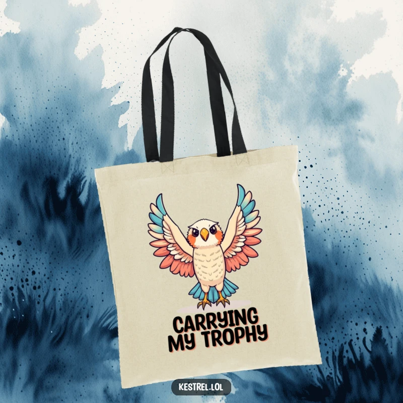 Funny triumphant kestrel tote bag depicting a kestrel character raising its wings in victory, perfect for daily use.
