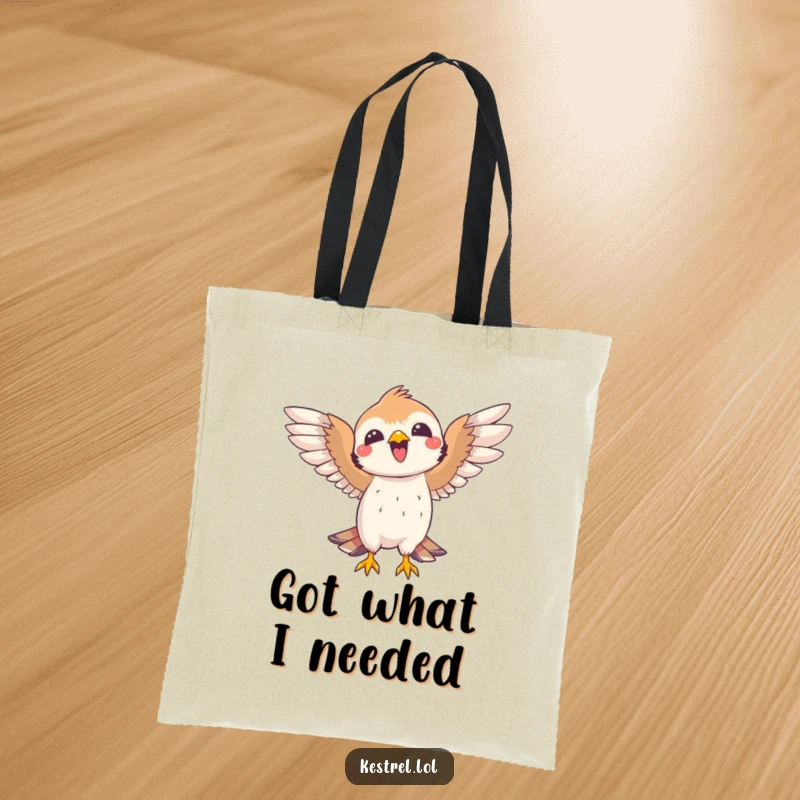 Funny kestrel tote bag depicting a joyful bird celebrating a catch with open wings. Practical and humorous.