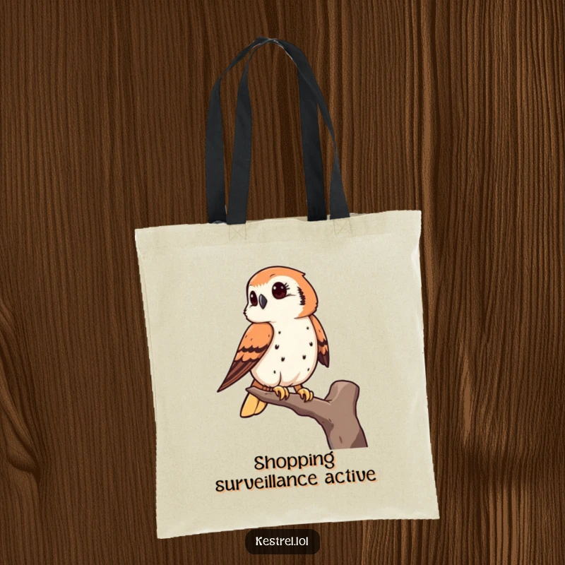 Funny kestrel tote bag showcasing a bird of prey keenly observing from a high perch, perfect for practical, humorous use.