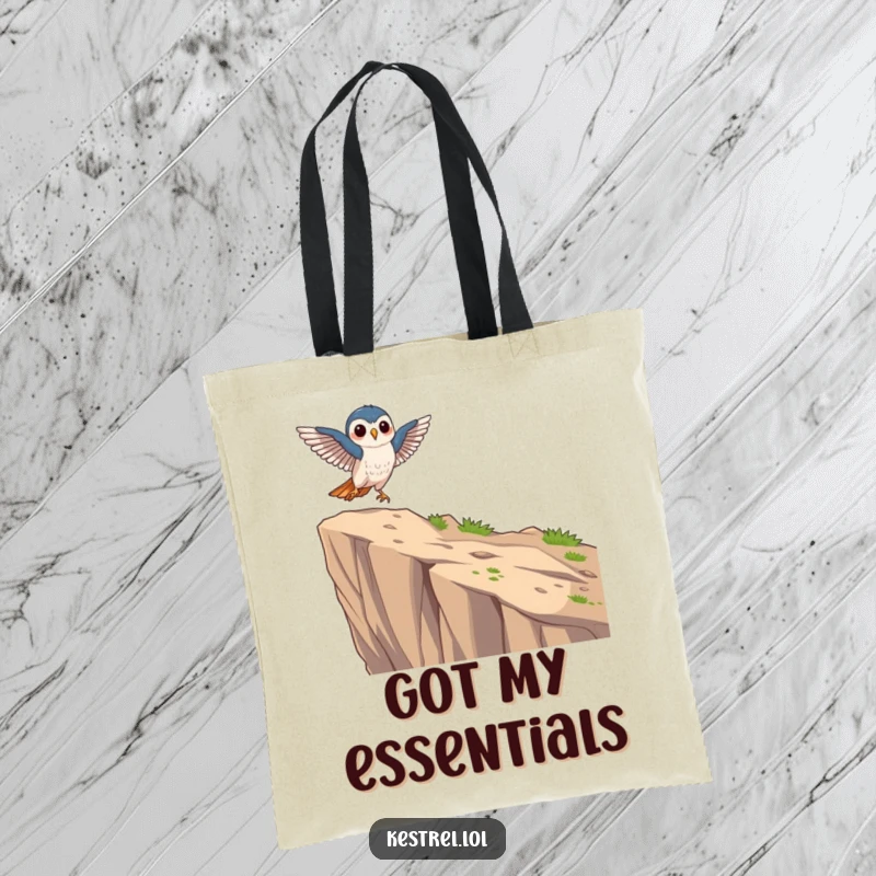 Funny focused kestrel tote bag depicting a kestrel character landing gracefully on a cliff edge, perfect for errands.