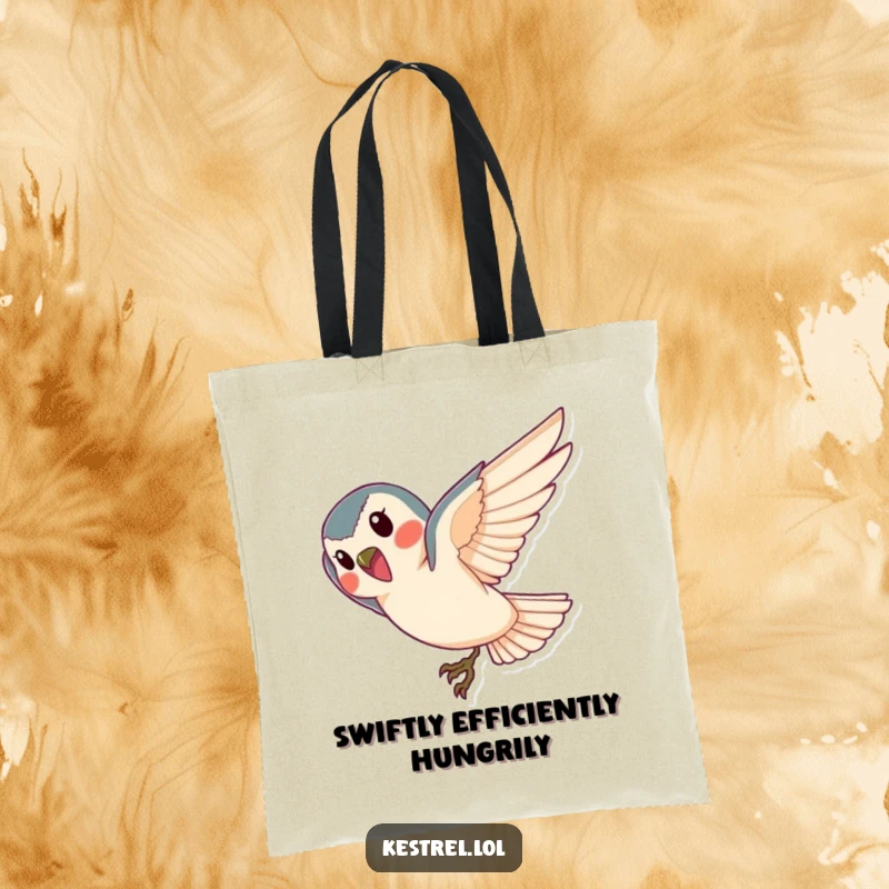 Funny kestrel tote bag, featuring a cheerful bird diving gracefully towards the ground; a stylish accessory.