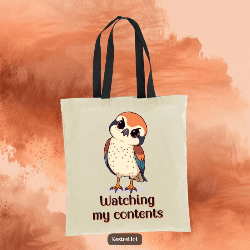 Funny kestrel tilts its head curiously, observing with sharp eyes, on a versatile tote bag.